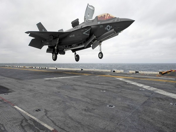 A Lockheed Martin F-35B Lightning II Joint Strike fighter jet touches down on the amphibious assault ship USS Wasp in East China Sea