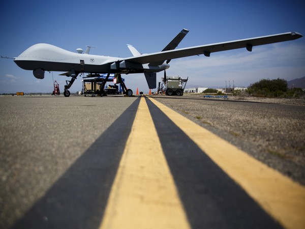 A General Atomics MQ-9 Reaper stands on the runway during "Black Dart", a live-fly, live fire demonstration of 55 unmanned aerial vehicles, or drones, at Naval Base Ventura County Sea Range, Point Mugu, near Oxnard, California