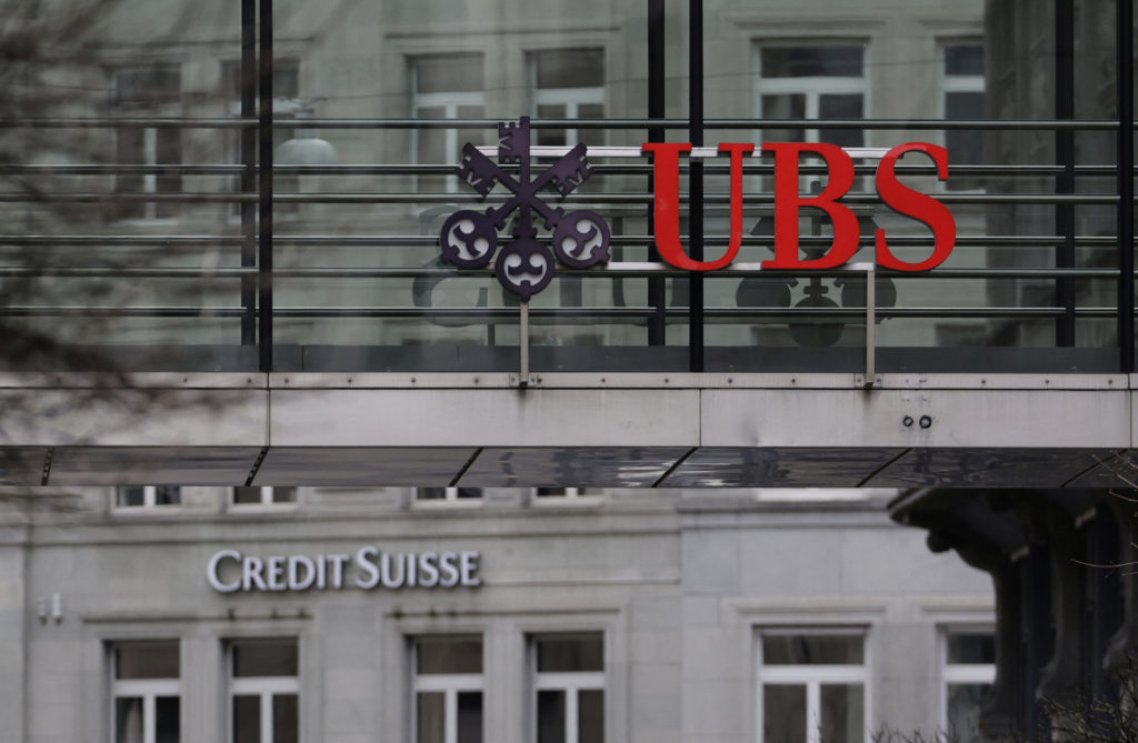 Logos of UBS and Credit Suisse banks are seen in Zurich