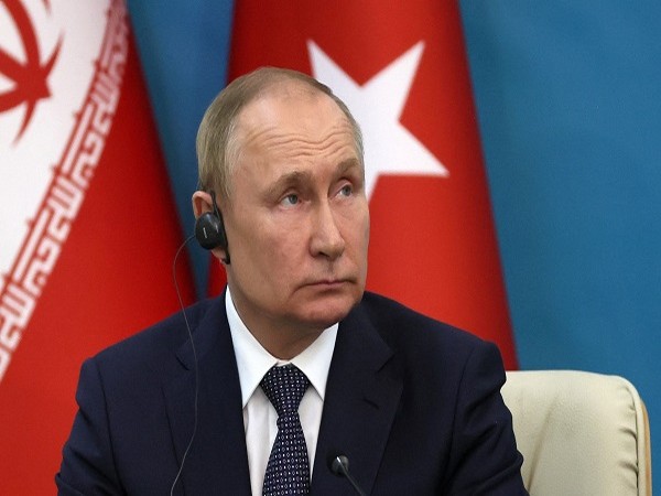 Russian President Putin attends a news conference in Tehran