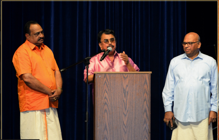 Dr. Babu Stephen, President of FOKANA speaking at the Onam celebrations, flanked by Ex presidents