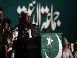 Hafiz Saeed, head of the Jamaat-ud-Dawa organisation and founder of Lashkar-e-Taiba, gestures while addressing his supporters during a convention in Karachi